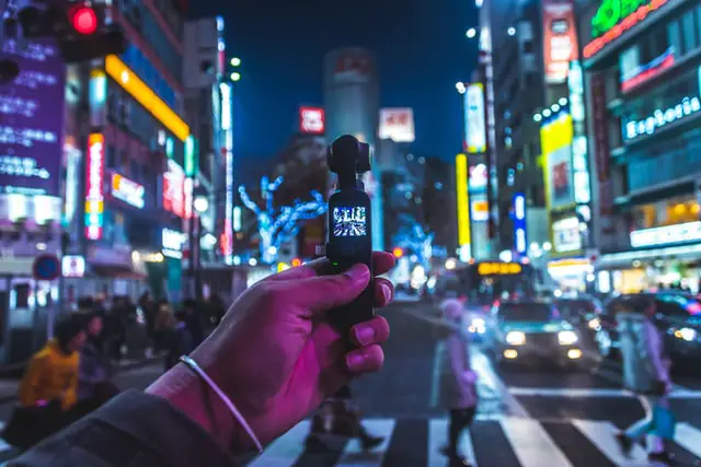 DJI Osmo Pocket, a handheld vlogging camera with a front facing screen