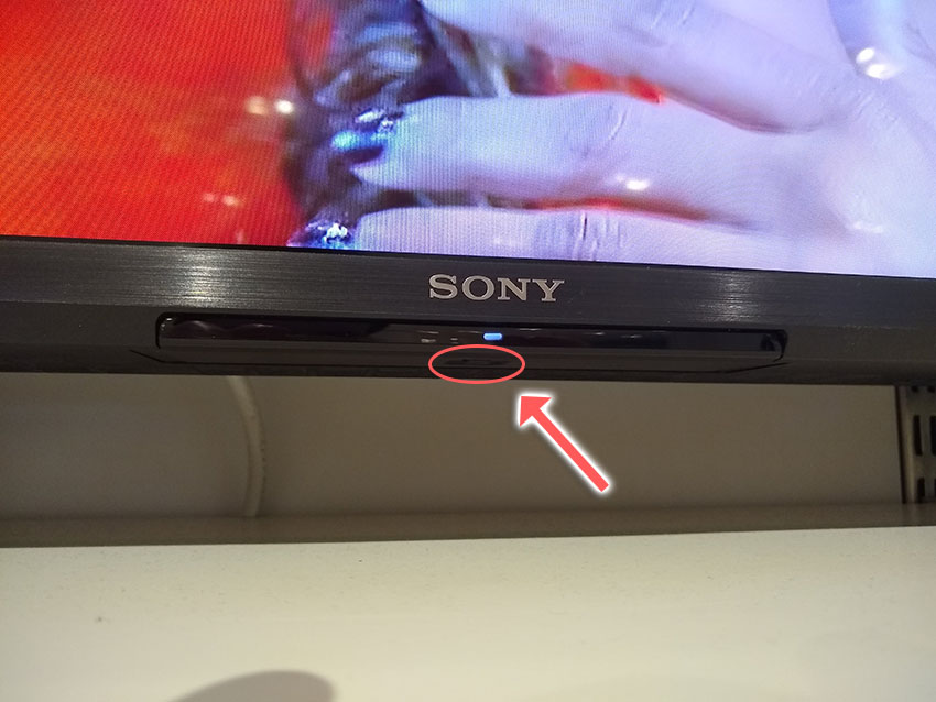 sony tv power button is underneath the logo